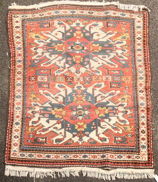 A Kazak rug, 6ft by 4ft 10in.